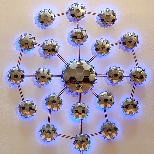 Sculpture titled: The Reflection and the Trace: Around the Globe using security mirrors, LED, and stainless steel